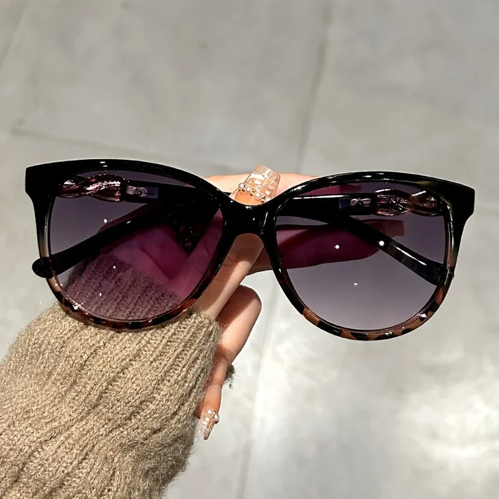 Lunettes de soleil œil de chat Élégance, coloris noir léopard